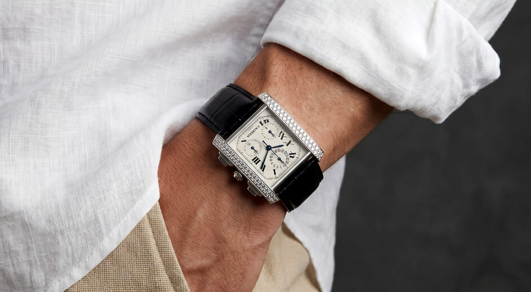 A photo of a wrist wearing a Cartier Tank Française LM Chronoreflex.