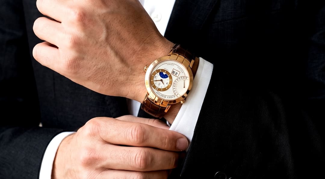 Photo of an arm wearing a Harry Winston Premiere Excenter Time Zone watch.