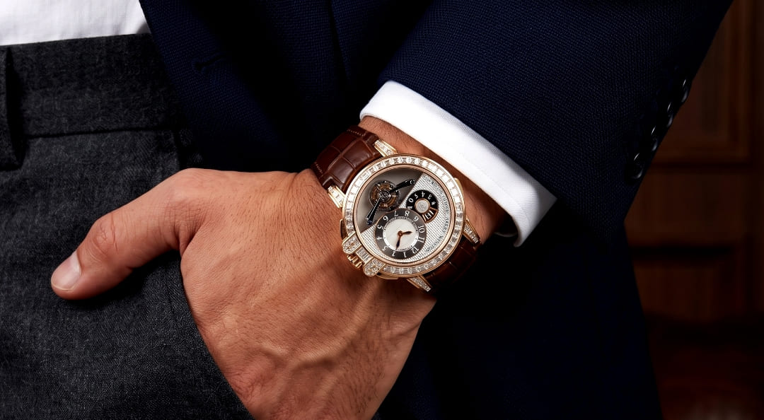A photo of a person's arm wearing a Harry Winston Ocean Tourbillon Big Date watch.