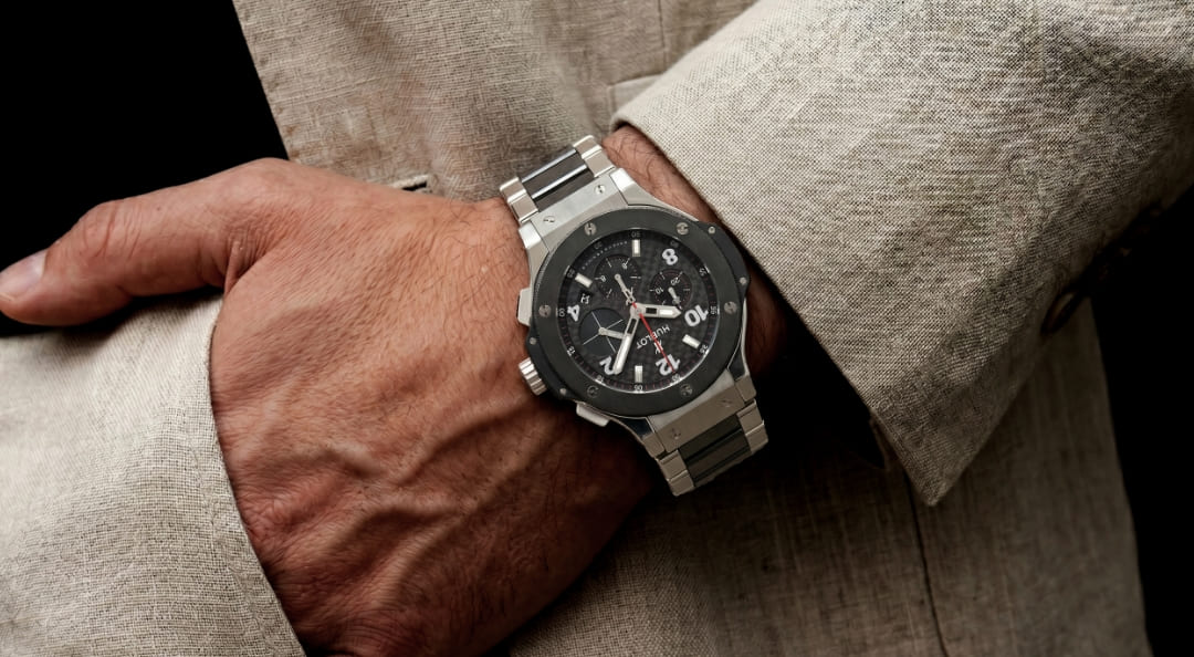 Photo of an arm wearing a Hublot Big Bang watch.