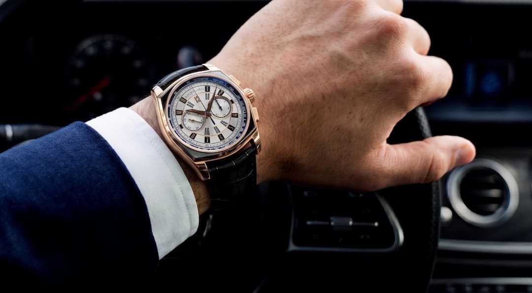 A photograph of a wrist wearing a Roger Dubuis Monégasque Micro-Rotor Chronograph.
