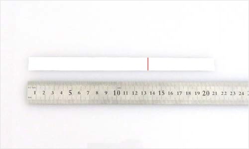 Photograph of measuring paper with a ruler