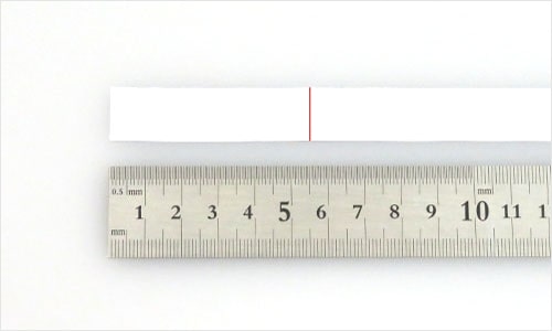 Photograph of measuring paper with a ruler
