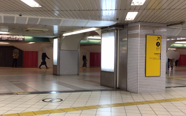 There is a guide board for Exit 2 on your right, so please follow the guide.